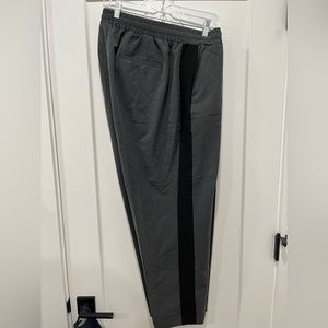 Gray pull on dressy joggers with draw string waist. Black stripe down the side.
